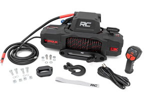 Rough Country 13,000lb electric winch mounted on a 4x4 truck for heavy-duty off-road recovery