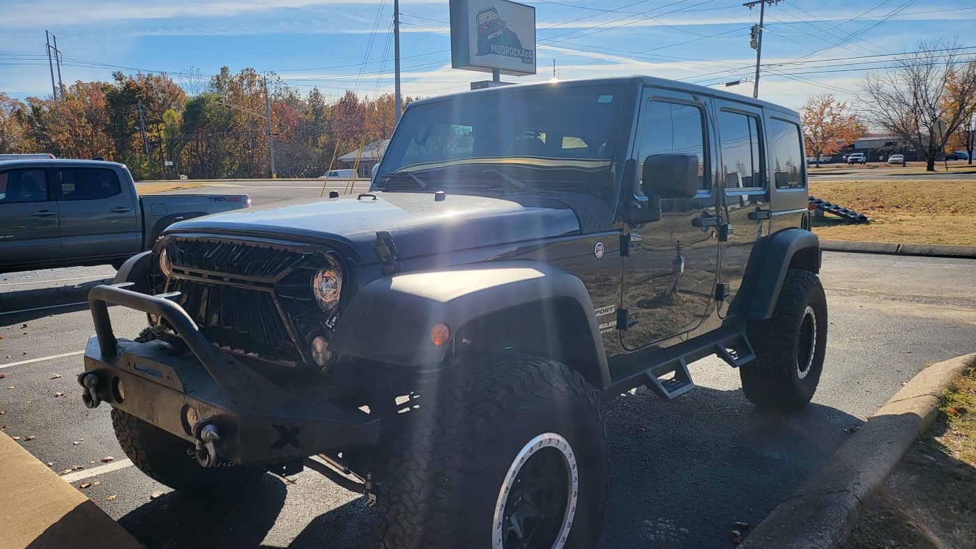 Driver side front quarter with MudRock4x4 sign