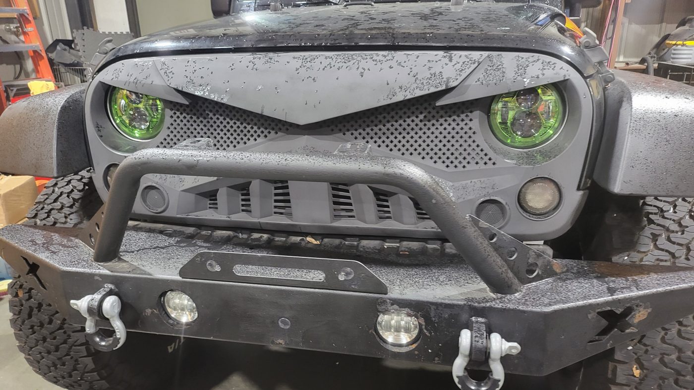 Front closeup showing green LED halos and angry grill