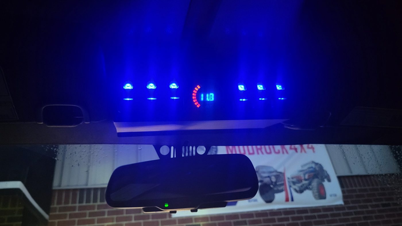 Switch panel lit up with blue LEDs and voltmeter